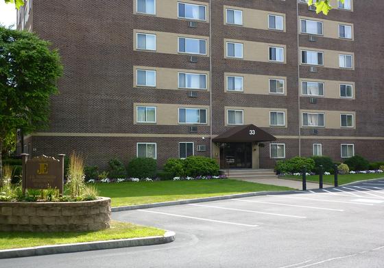 Entrance and grounds at the J.E. Quincy apartment building