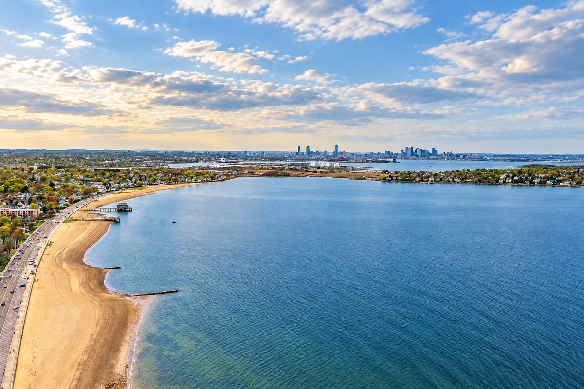 The Quincy shoreline along Quincy Bay with the Boston skyline in the distance