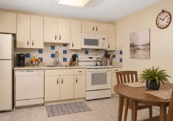 Kitchen with white cabinets at 345 and 330 Lincoln Street, Waltham