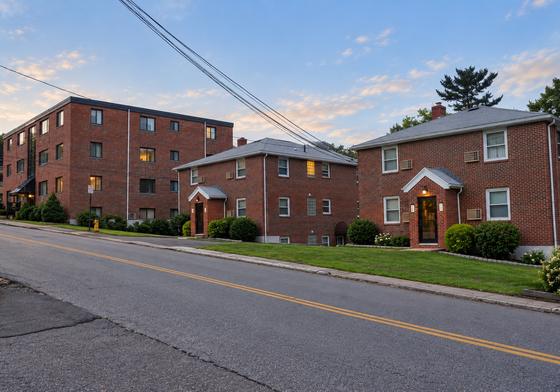 J.E. apartment buildings on Lincoln Street, Waltham, at dusk