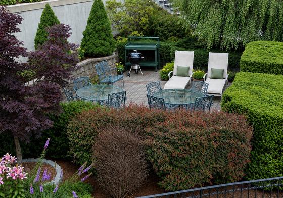 Landscaped patio and seating area at J.E. Waltham